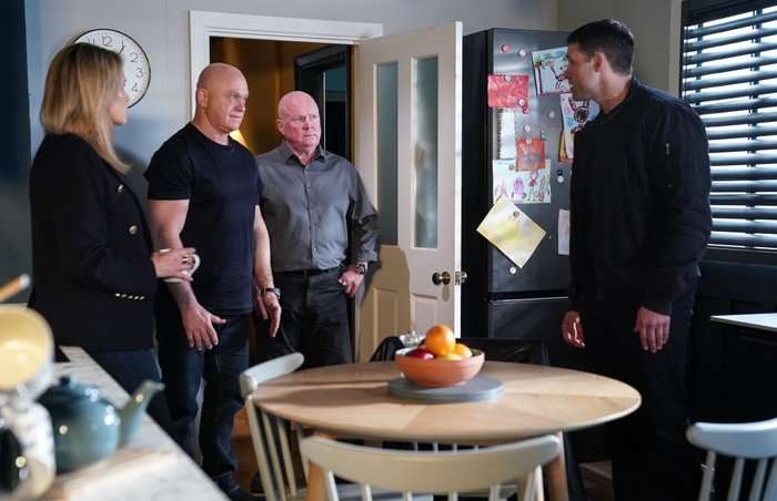 Grant and Phil confront Mark in a scene from EastEnders