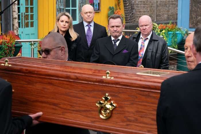 Sam, Grant, Billy and Phil stood in front of Nigel's coffin in EastEnders