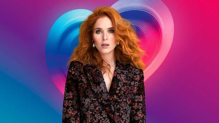 Angela Scanlon stood looking ahead with her lips slightly pursed.
