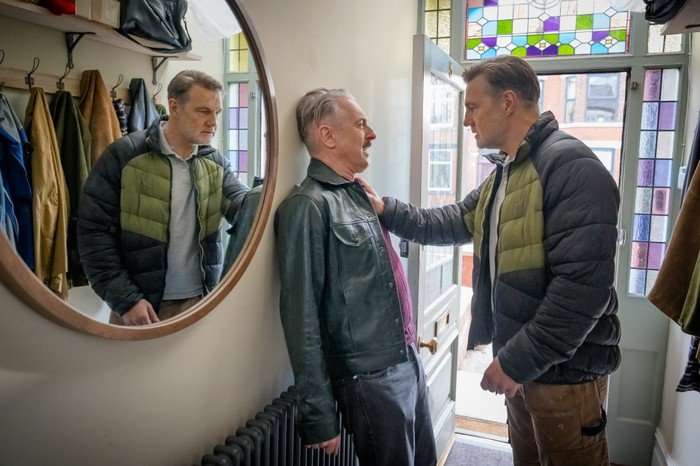 Leo (Alan Cumming) is confronted by Clive (David Morrisey) Leo (Alan Cumming) is confronted by Clive (David Morrissey) in the hallway of a house