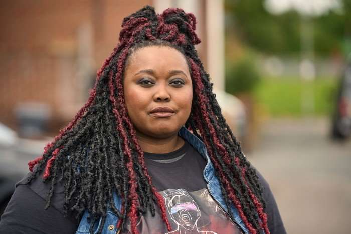 Luyanda Unati Lewis-Nyawo as Judy in Tip Toe. She is standing on a residential street in the daytime, looking at the camera.