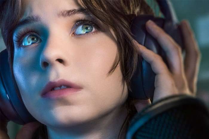 A Good Girl's Guide To Murder S2_EMBARGO A Emma Myers in A Good Girl's Guide to Murder, looking up, wearing over the ear headphone and holding them.