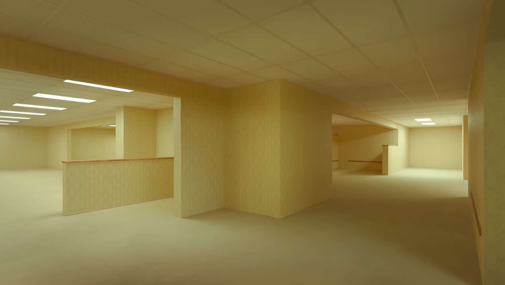 A room with yellow wallpaper in the teaser trailer for the A24 film, The Backrooms.