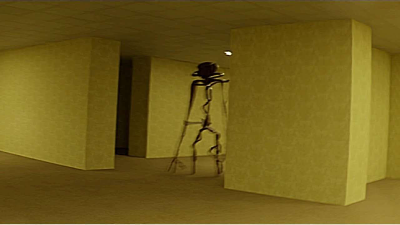 A strange figure in a yellow hallway in the short film The Backrooms