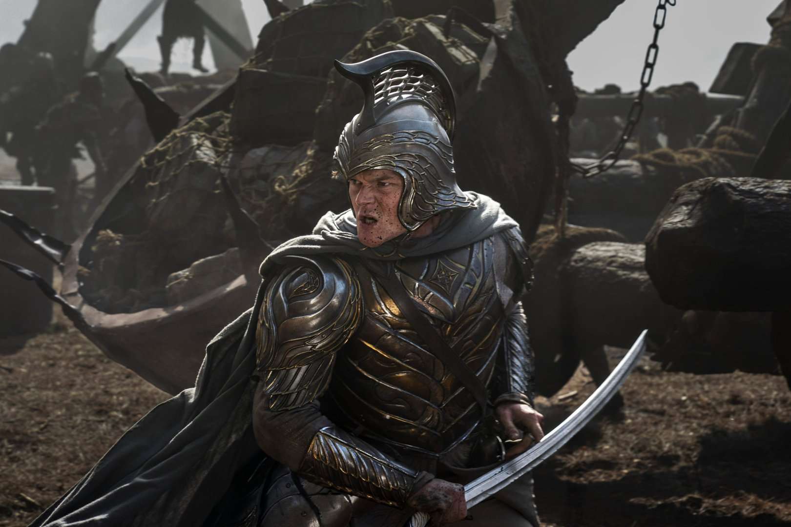 An armor-clad Elrond wields an Elvish sword in The Lord of the Rings: The Rings of Power season 2.