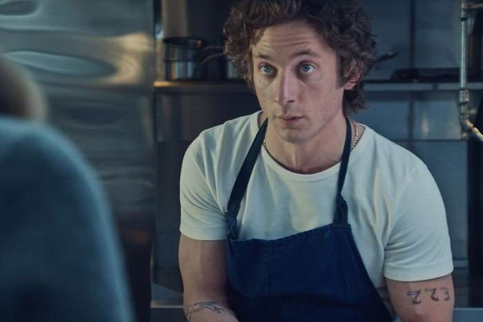 Jeremy Allen White, wearing a chef's apron in The Bear season 3