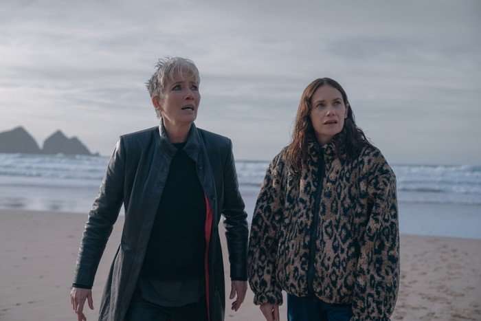 Down Cemetery Road Emma Thompson and Ruth Wilson in Down Cemetery Road, stood on a beach together looking shocked at something off screen.