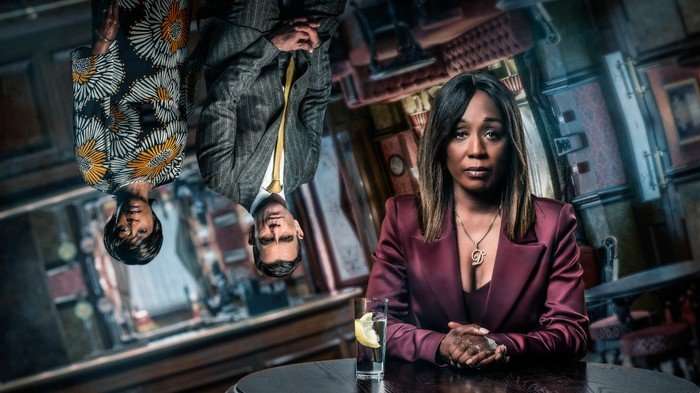 In a poster in the Queen Vic, Denise Fox with Jack Branning and Yolande Trueman in EastEnders.