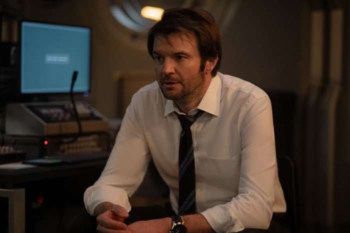 Costa Ronin as Lenya in For All Mankind season 5 Costa Ronin as Lenya in For All Mankind season 5. He's wearing a shirt and tie with the top button undone and looks bedraggled.