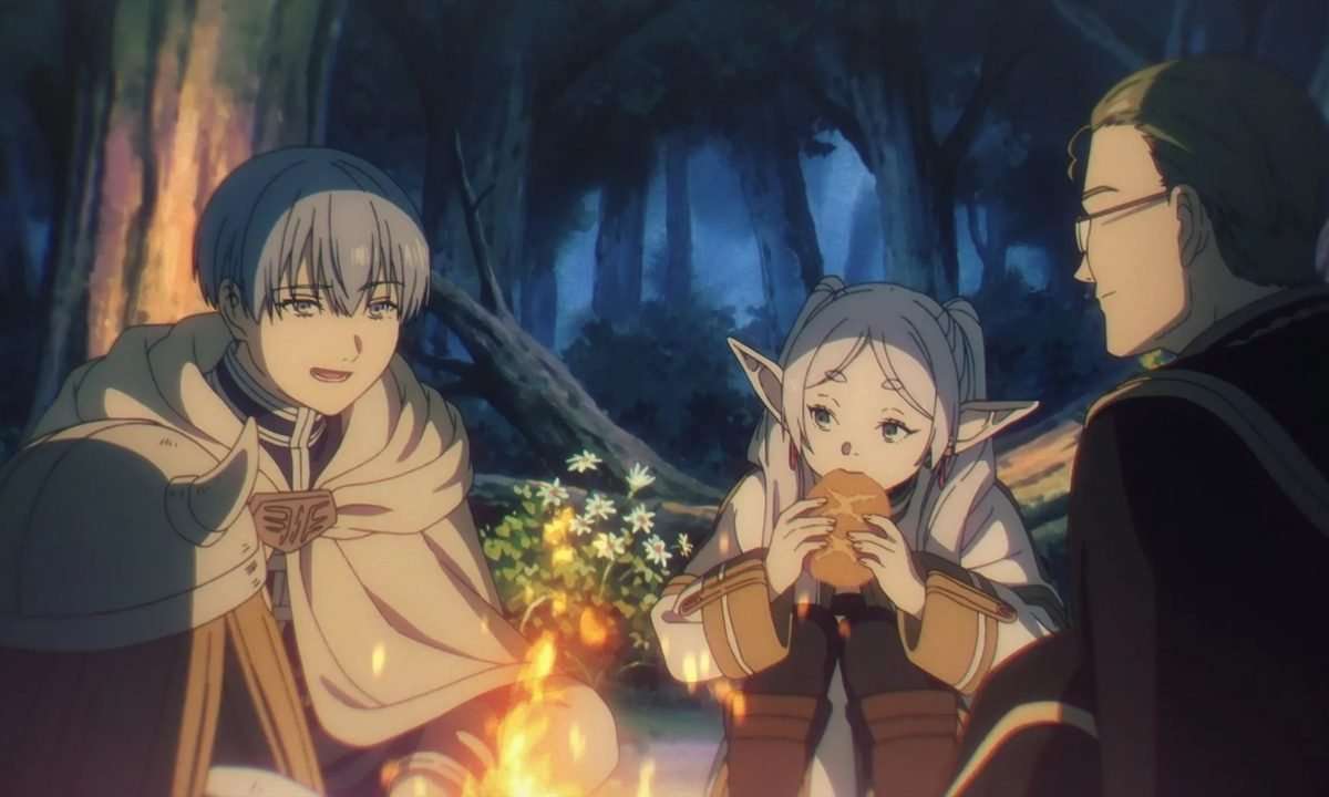 Frieren eating with the rest of her companions by a campfire in Frieren: Beyond Journey's End.