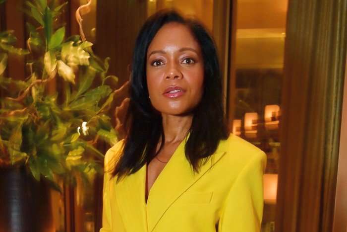 Naomie Harris, wearing a yellow jacket.