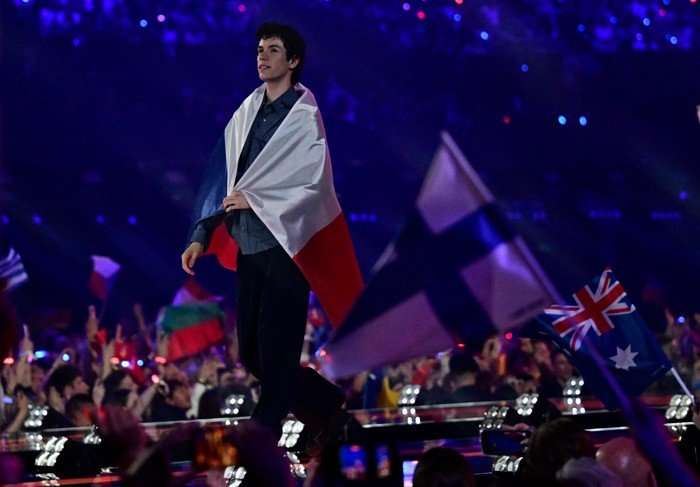 AUSTRIA-ENTERTAINMENT-MUSIC-TELEVISION-ESC-FINAL Daniel Zizka stood on stage with a Czechia flag wrapped around him.