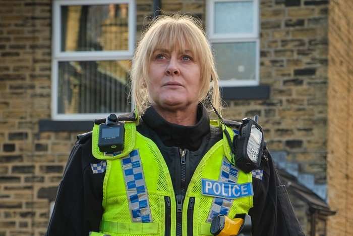 Sarah Lancashire as Catherine Cawood in Happy Valley, wearing police uniform and looking into the distance