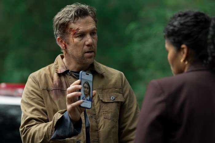 Patrick Brammall in Last Seen. Ian Ridley showing a picture of his daughter in Last Seen.