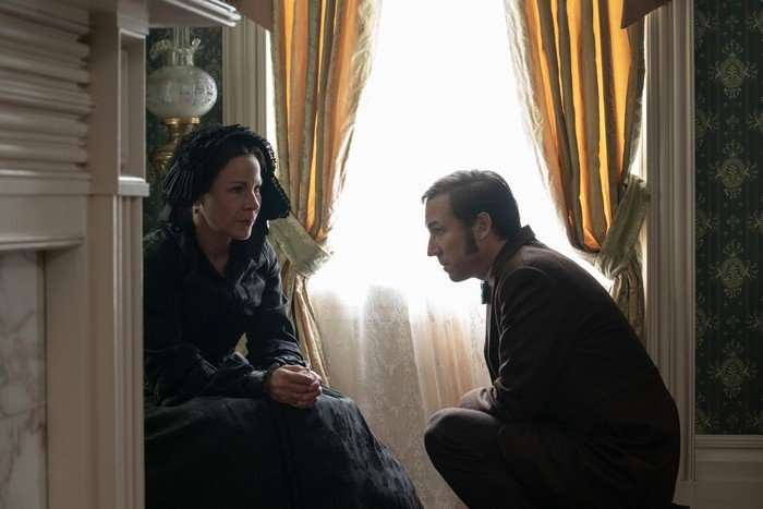 Manhunt_Photo_010201 Tobias Menzies as Edwin Stanton and Lili Taylor as Mary Todd Lincoln in Manhunt. Mary is sat down and Edwin is crouched down next to her.