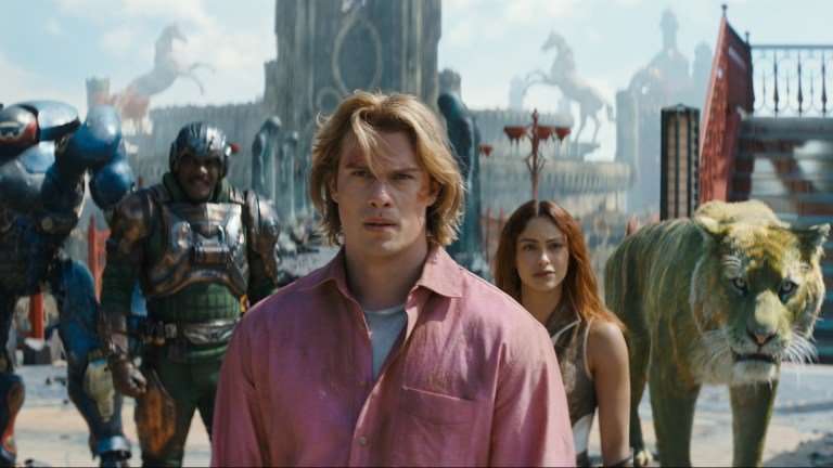 (l-r): Roboto (Kristen Wiig), Man At Arms (Idris Elba), Adam (Nicholas Galitzine), Teela (Camila Mendes) and Cringer in MASTERS OF THE UNIVERSE.