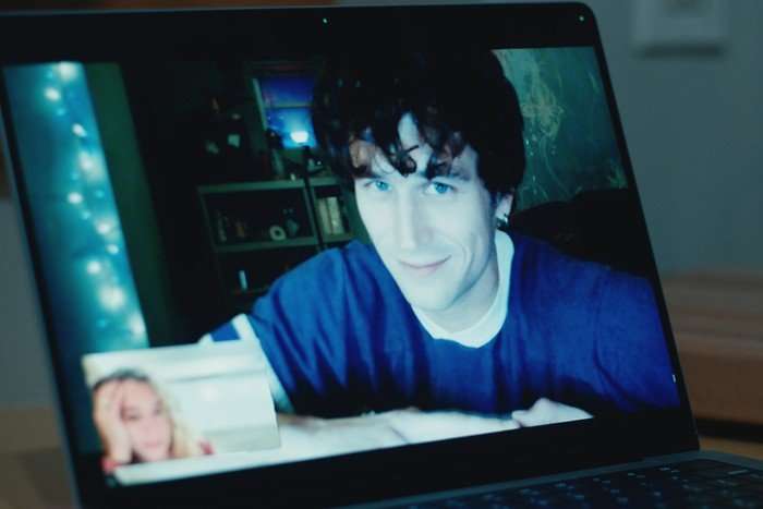 Maximum_Pleasure_Guaranteed_Brandon_Flynn Brandon Flynn stars in Maximum Pleasure Guaranteed; his character is seen here on a laptop screen, during a video call with Paula (Tatiana Maslany), who is minimised in the bottom left-hand corner
