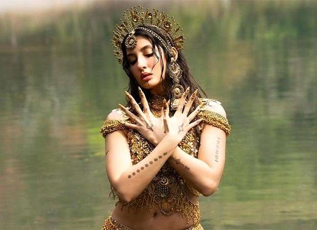 Nora Fatehi stuns as an ethereal water goddess in &lsquo;Body Roll&rsquo;; fans can&rsquo;t stop talking about her gold-adorned look
