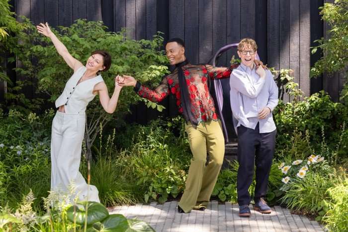 Strictly stars visit RHS Chelsea Flower Show - 22 May 2026 Emma Willis, Josh Widdicombe and Johannes Radebe pose in a garden. Emma holds hands with Johannes, who has his hand over Josh's shoulder, as they pose