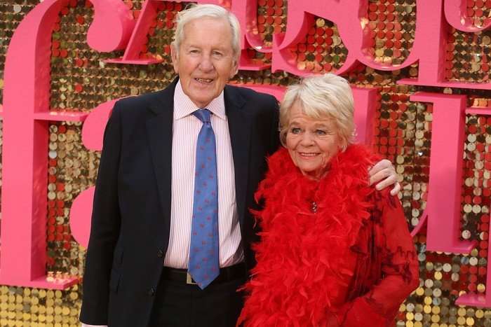 RadioTimes Edits (2) Judith Chalmers and her husband Neil Durden-Smith at the Absolutely Fabulous: The Movie premiere