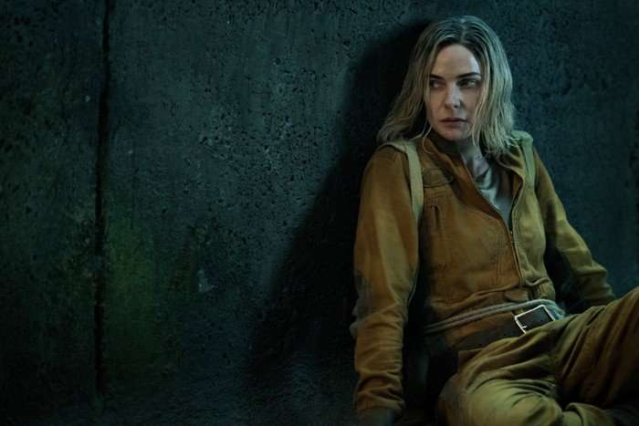 Rebecca Ferguson in Silo season 2 Rebecca Ferguson in Silo season 2 sitting in a brown jumpsuit