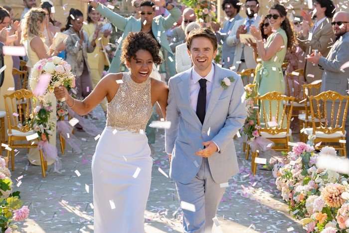 The Assassin S2 Two people with confetti around them having just got married.