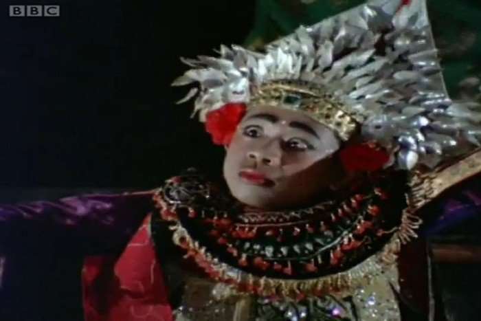 A balinese man performing a traditional dance.