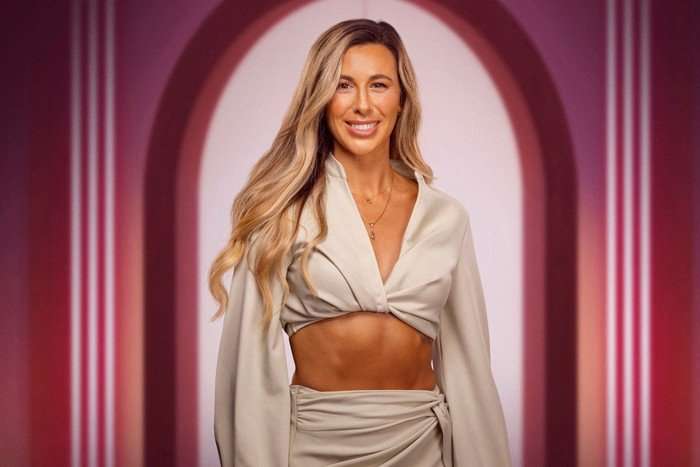 Catherine for Love Is Blind UK. She is weairng a two-piece set and is smilng ahead.