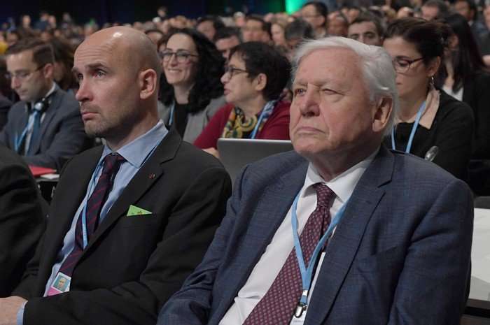 Natural historian Sir David Attenborough (R) listens to speeches during the COP24 summit on climate change in Katowice, Poland, on December 3, 2018.