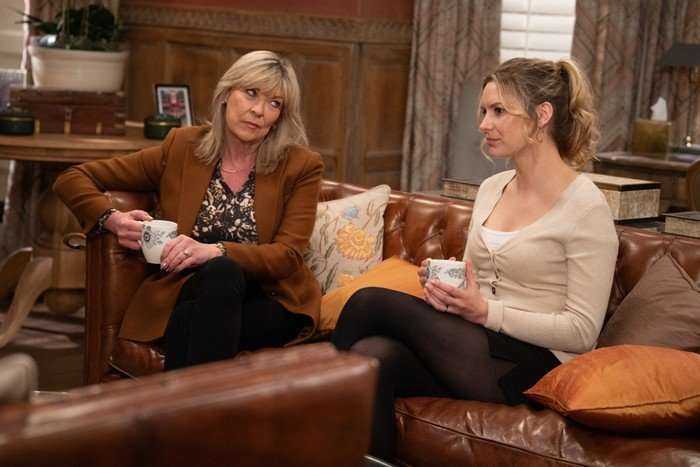 emmerale-dawn-kim Kim and Dawn sat on the sofa at Home Farm in Emmerdale