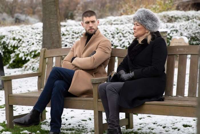 emmerdale-joe-kim Joe and Kim sitting on a bench at the cemetery in Emmerdale