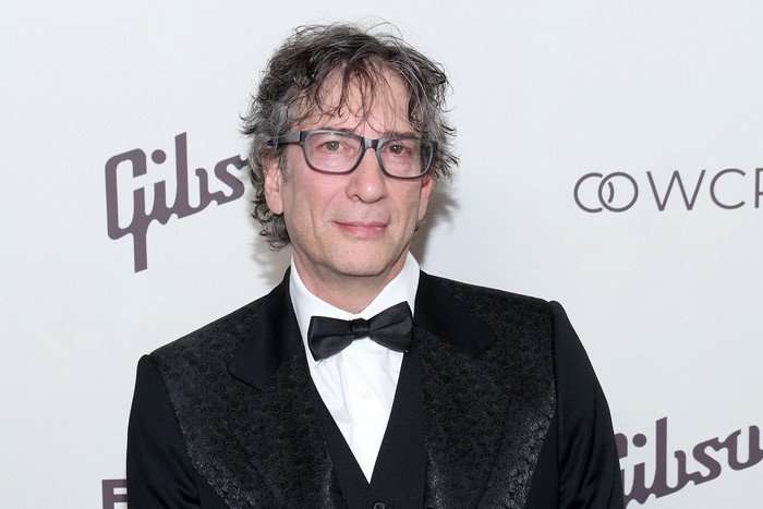 Neil Gaiman photographed in a black tuxedo at an event