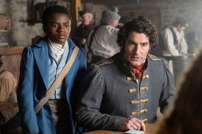 Eddie Karanja and Tom Ellis star in Washington Black, wearing formal period clothing and looking sternly at someone ahead of them