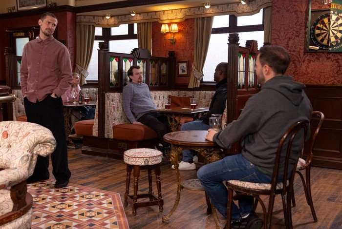 01_06_coro_carl_tyrone_01 Carl approaches Tyrone in the Rovers in a scene from Coronation Street