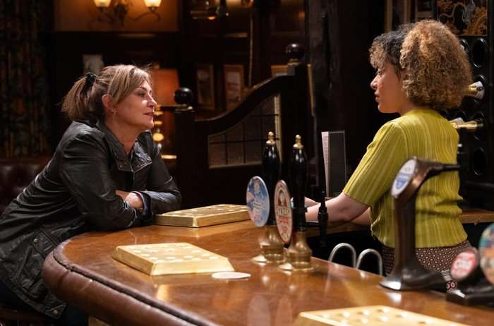 Moira chats to Serena over the bar in a scene from Emmerdale