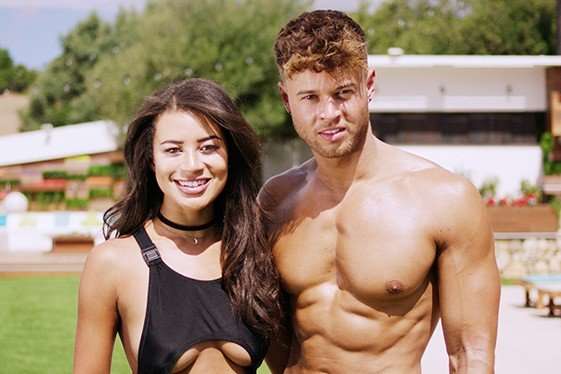 Montana Brown and Alex Beattie Montana Brown and Alex Beattie stood next to each other, smiling. Montana is wearing a black swimsuit while Alex is topless.