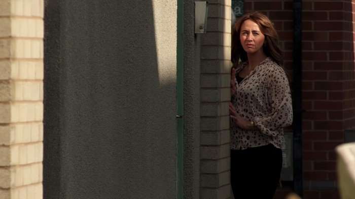 15_06_coro_gary_sarah_maria_03 Maria peeks around a corner in Coronation Street
