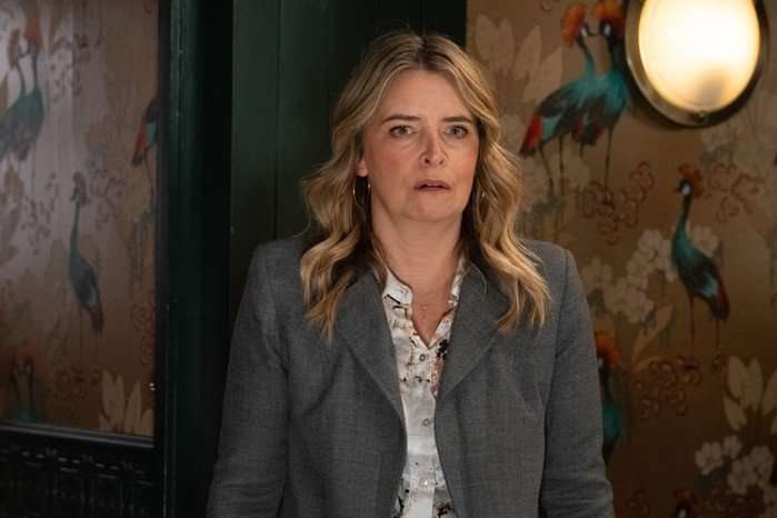 Charity looks stunned in a scene from Emmerdale