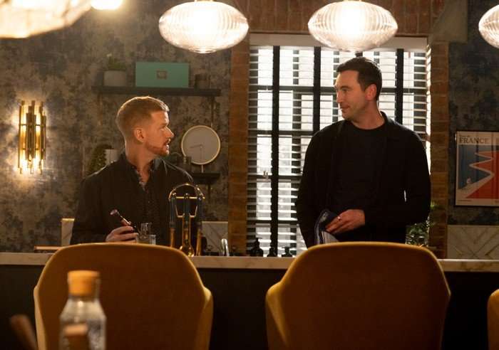 22_06_coro_dinner_party_05 Gary and Kit stare at one another in a scene from Coronation Street