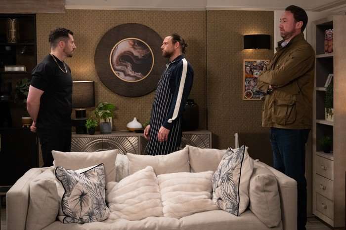 22_06_emm_ross_kev_liam_01 Liam stands with his arms crossed as Ross and Kev have an argument in Emmerdale