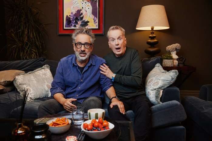 David Baddiel and Frank Skinner looking shocked as they sit next to each other.