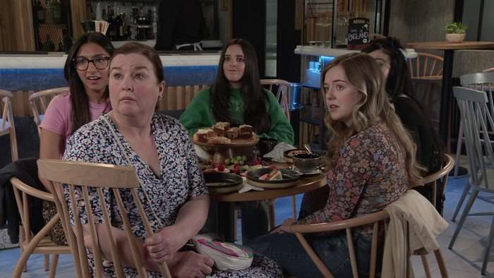Nina, Mary, Amy, Summer and Nina sat around a Viaduct Bistro table in Coronation Street