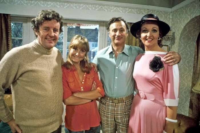 The cast of The Good Life standing together on set.