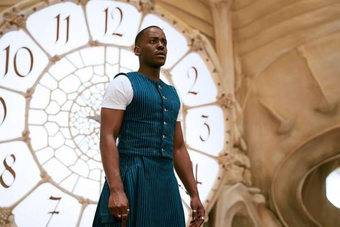 Ncuti Gatwa as The Doctor in Doctor Who stood by a large clock looking concerned