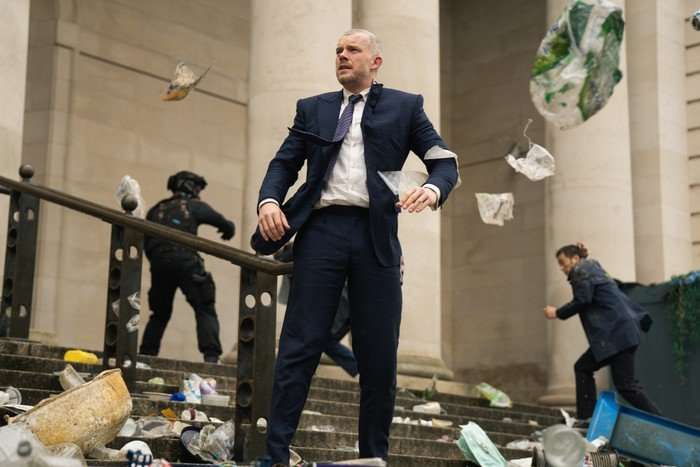 Russell Tovey as Barclay in The War Between the Land and the Sea, with pieces of plastic flying around him Russell Tovey as Barclay in The War Between the Land and the Sea, with pieces of plastic flying around him