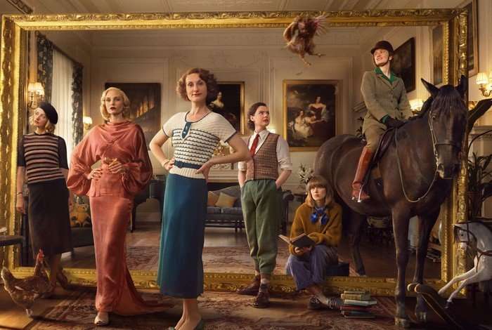 From left to right, Shannon Watson as Unity Mitford, Joanna Vanderham as Diana Mitford, Bessie Carter as Nancy Mitford, Isobel Jesper-Jones as Pamela Mitford, Zoe Brough as Jessica Mitford, and Orla Hill as Debo Mitford on a horse, in a promo image for Outrageous.