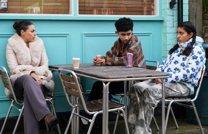 557202,TITLE:Eastenders Priya chats to Nugget and Avani outside the caff in EastEnders