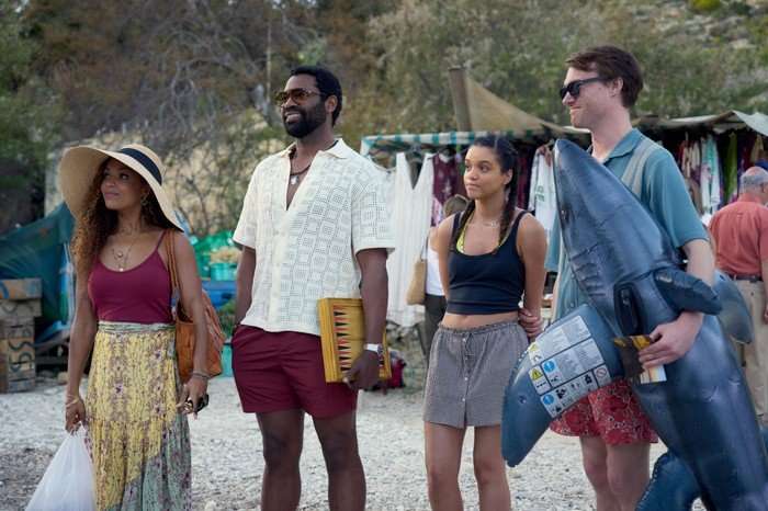Antonia Thomas as Jess, Nicholas Pinnock as Solomon, Maria Almeida as Avery and Hugh Skinner as Jacob in Two Weeks in August, stood together in a line, smiling.
