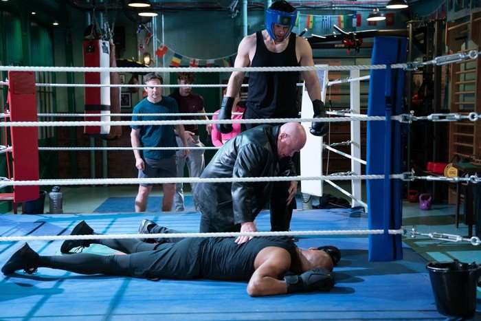 564093,TITLE:Eastenders Mark and Phil stand over a lifeless George in the boxing ring in a scene from EastEnders