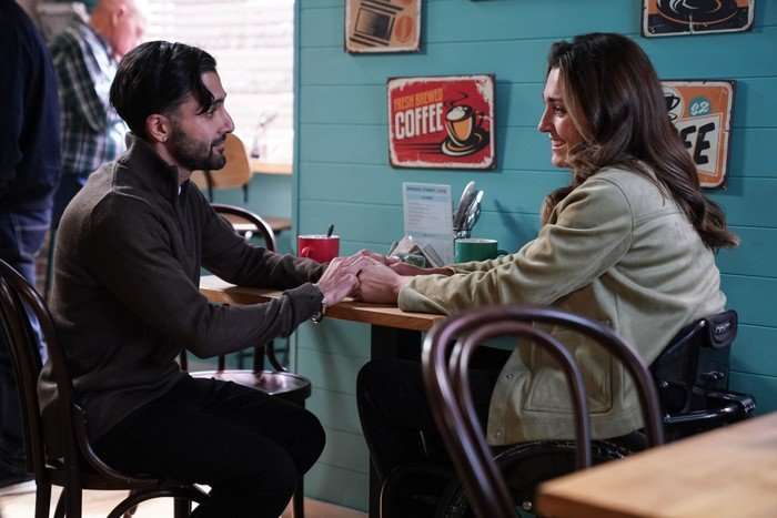 564798,TITLE:Eastenders Vinny and Penny hold hands in the caff in EastEnders